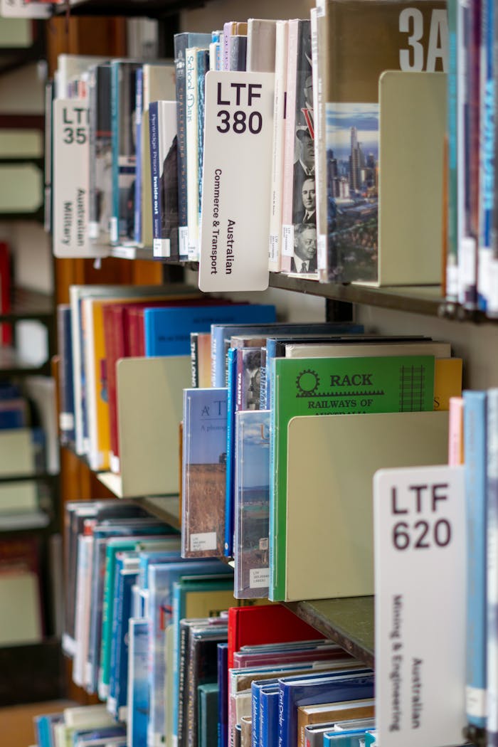 Close-up view of library shelves with various books, Melbourne, Australia.